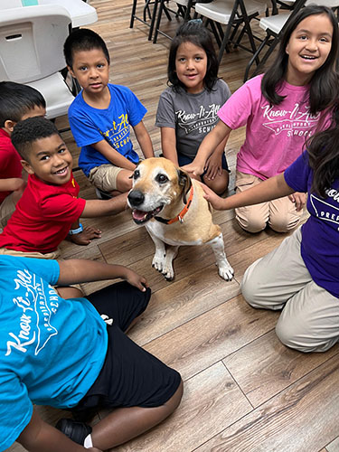 Students Taking Care of Dog